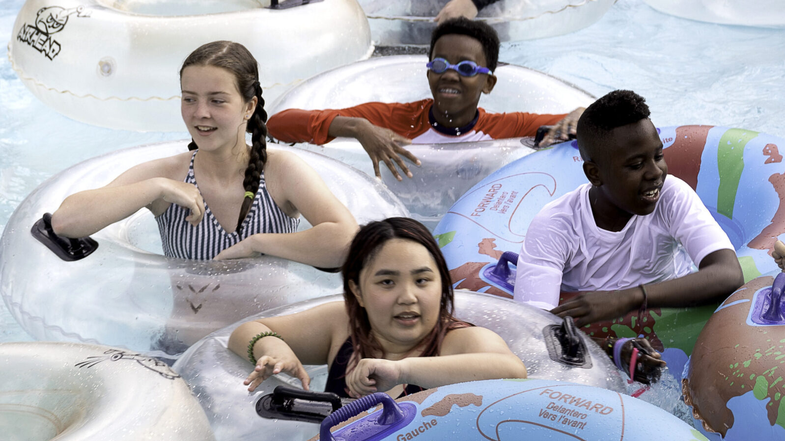 Picture of kids smiling in the pool